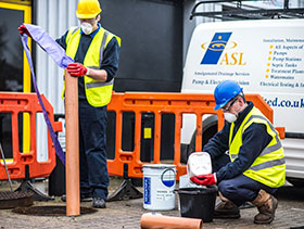 An image of drain lining being used to repair damaged drainage