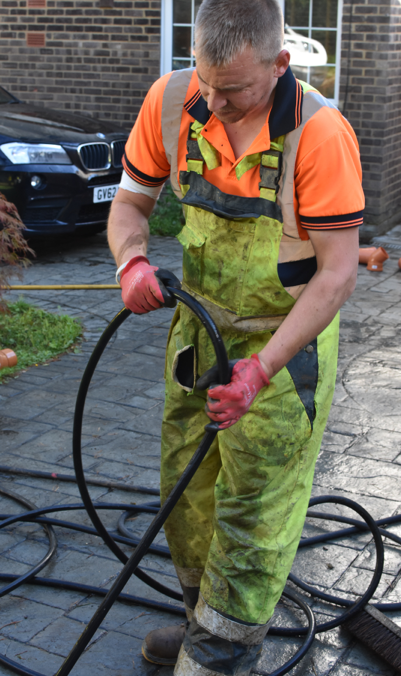 Our Liam cleaning a drain with jetting equipment.