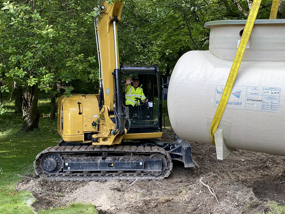Our gerry installing a sewage tank.