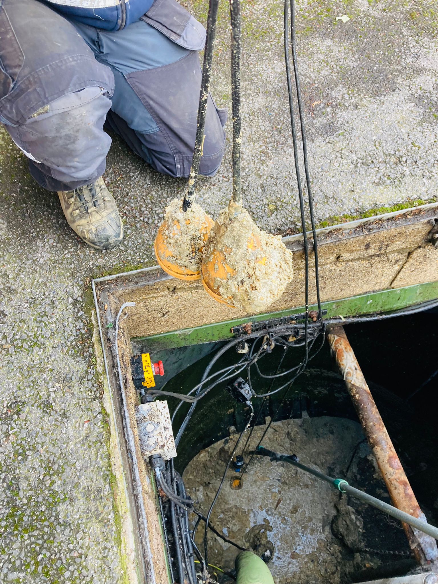 A pumping station float switch clogged with fat and grease