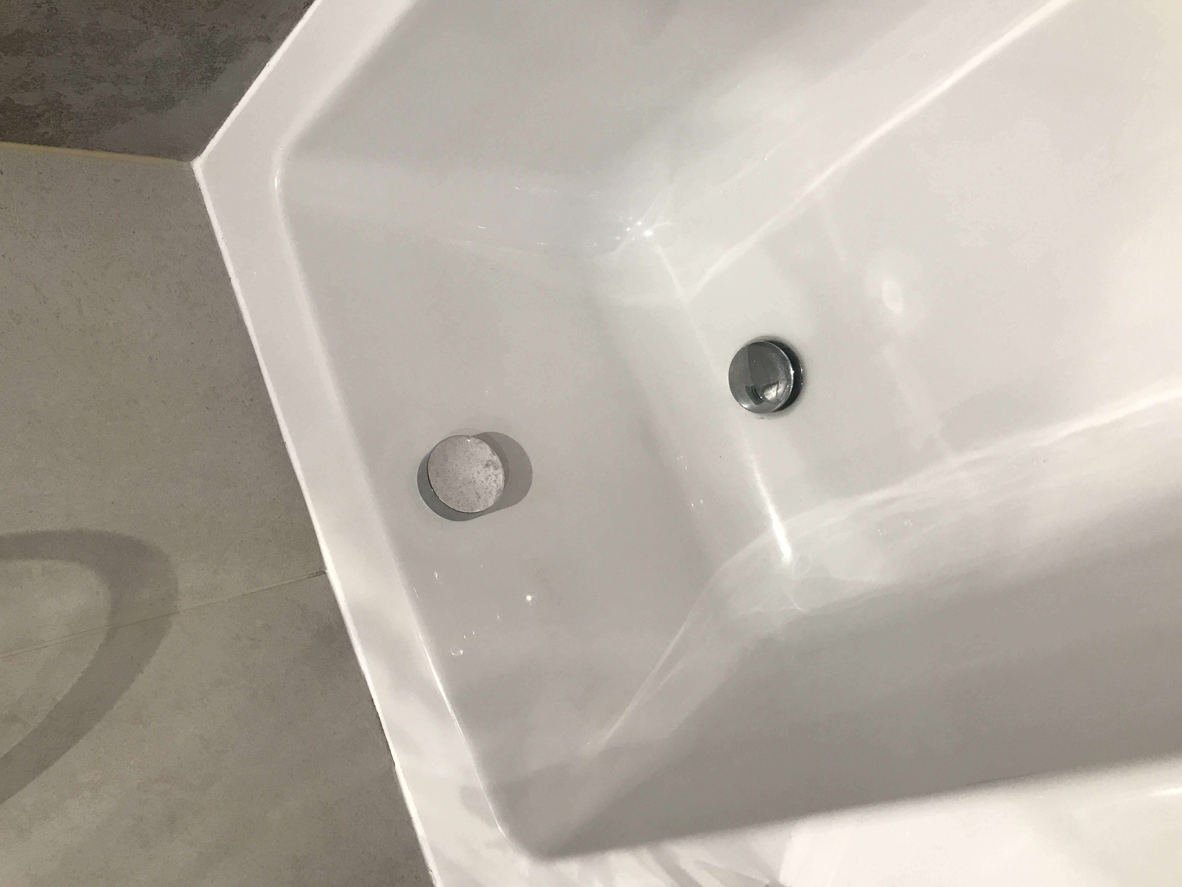 An image of a bath plug drain