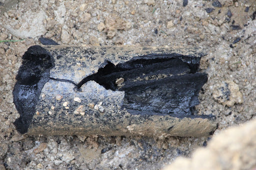 Pitch fibre drain pipe can be mistaken for blocked drain pipe covered in black sludge.