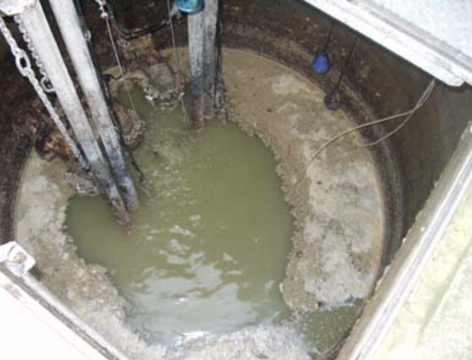 This is a photo of a pumping station with fat grease, and oil at the surface.