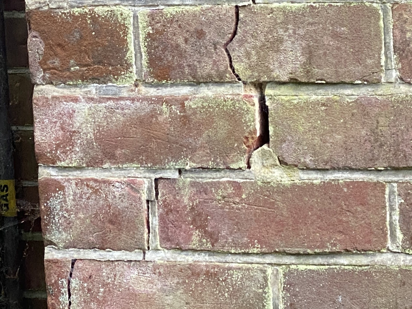 This image shows a crack in the brick work as a result of no gully surround.