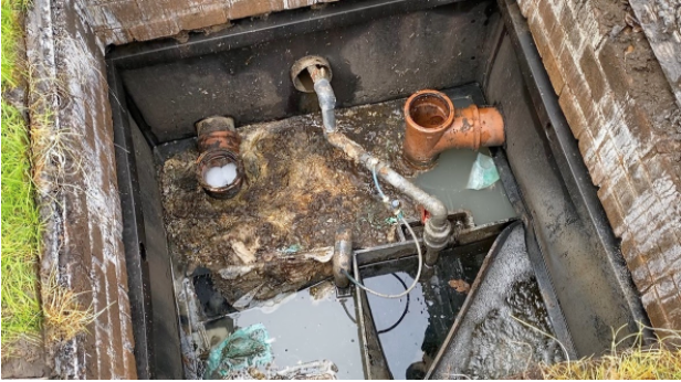 This image shows a sunken treatment plant that is so low the surface water is seeping in as well through the brickwork.