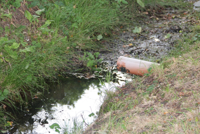 This image shows an outlet pipe in a trench drain