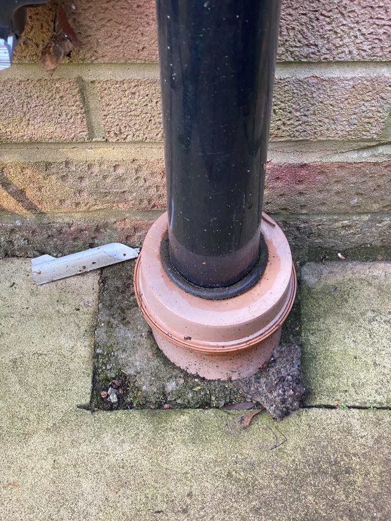 This image shows one method of directly connecting the downpipe to the gully making sure it doesn’t overflow or splash the foundations.