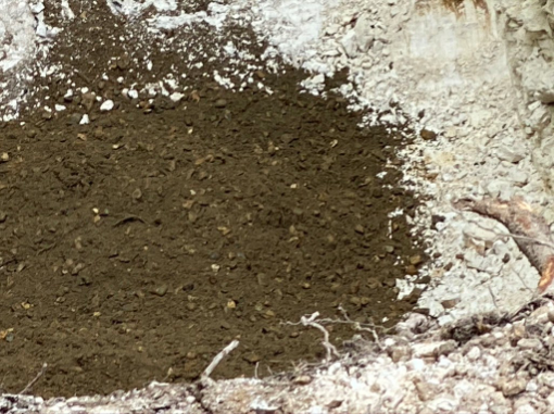 This image shows a layer revealed under a gravel layer.