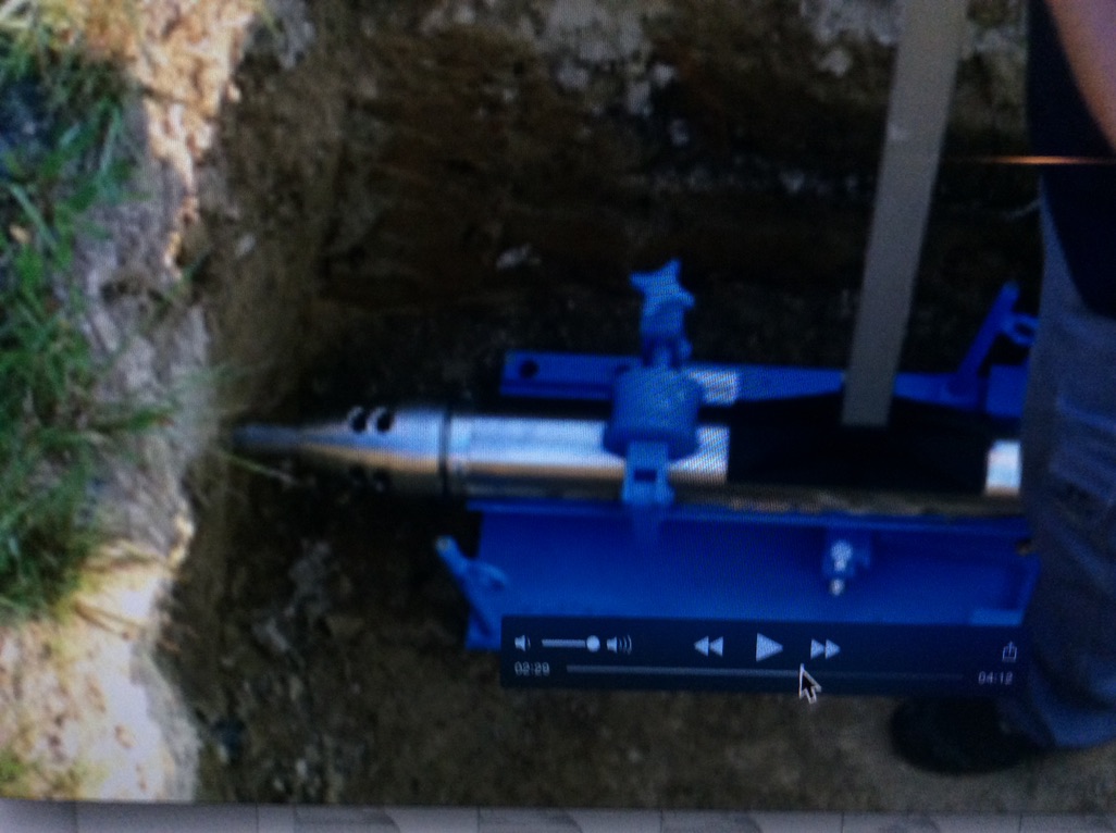 This is a photo of a mole in a launch pit to make a main drain connection via moling.