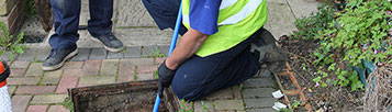 Drain rodding to clear a blocked drain.