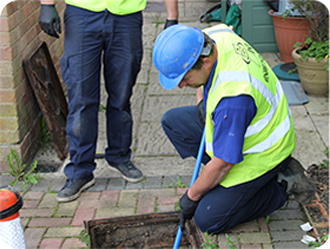 ASL Limited blocked drains personnel unblocking a drain.