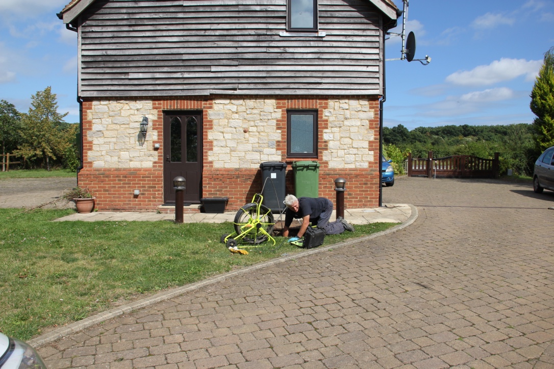 This image shows a cctv drain inspection survey being carried out by an ASL Limited engineer.