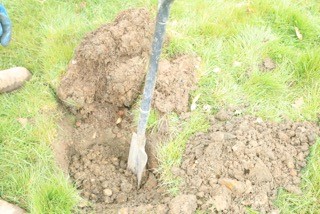 This image shows the initial hole being dug for access