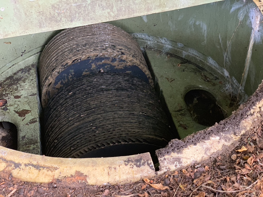 The wheel mechanism of a treatment plant with grease fat and oil.