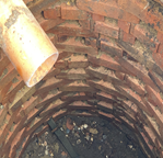 An image of an old brick septic tank