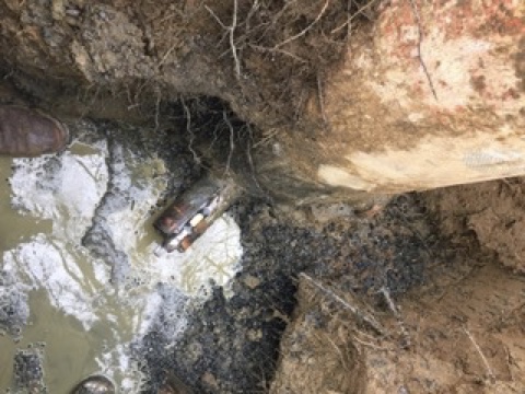 Example of pollution in the ground forced through by surface water that should not have been connected.