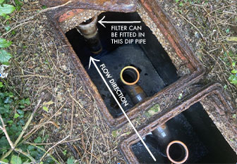 This photo of the two septic tank chambers shows the dip pipe that a filter can be added to.