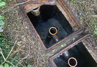 A septic tank viewed through an open utility hole by ASL Limited drainage experts.