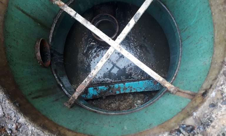 A septic tank feeding to drainage field or drainage field.