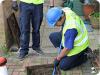 An image of ASL Limited drainage personnel clearing a blocked drain.