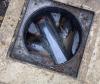 This is a photo of an open manhole just like the one found under the bedroom carpet!