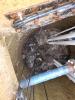 A photo of sewage and fat forming a brown crust around the float switches of a pumping station.