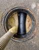 A pub's grease trap being emptied.