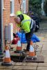 Our Darren using drain rods to clear a blocked drain in Guildford