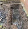 A picture of a garden that has been partitioned and is now too small for the required drainage field.