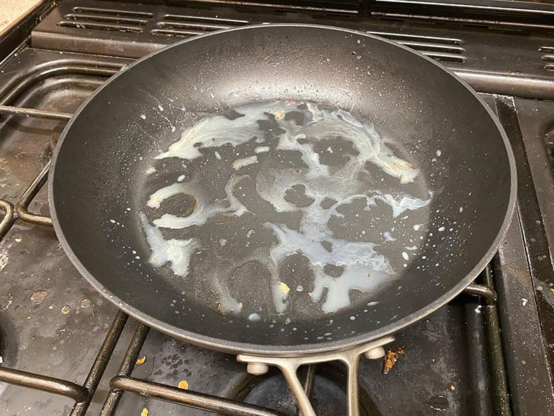 A frying pan with the fatty remnants of meat having been cooked. This will melt in warm washing up water but congeal in the drain.