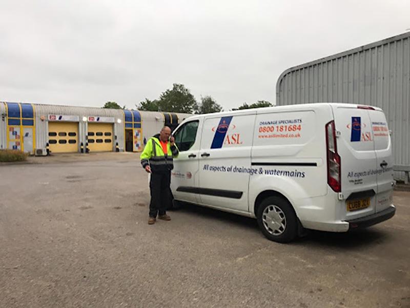 A photo of our Darren with his blocked drain clearance van outside head office.