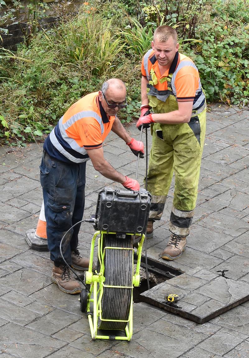Our Liam and John carrying out a blocked drain survey to find the blockage and fault.
