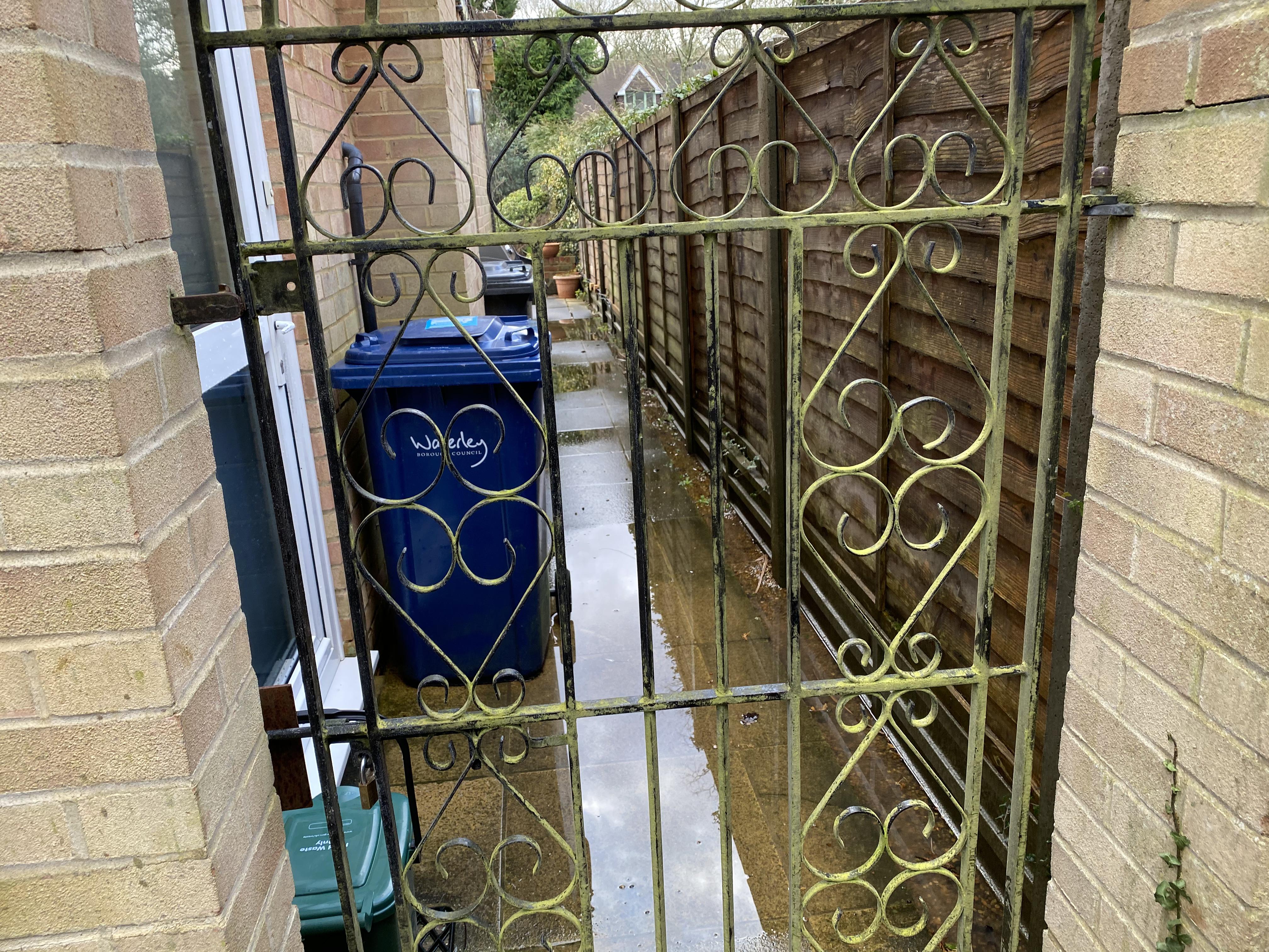 A photo of a flooded private footpath due to blocked gully drains.