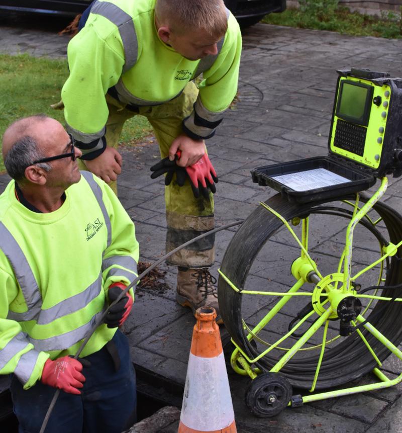 A photo of our John and Liam carrying out a CCTV drainage survey.