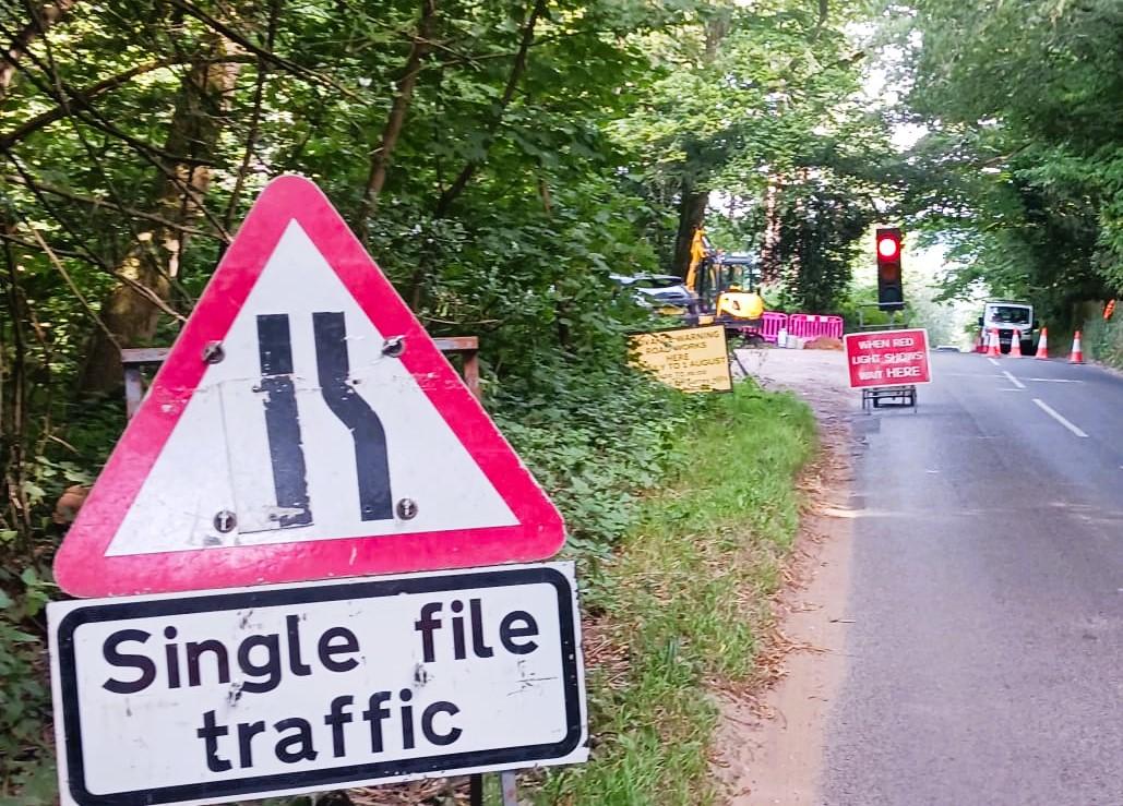 An imag of traffic control during a main sewer connection.