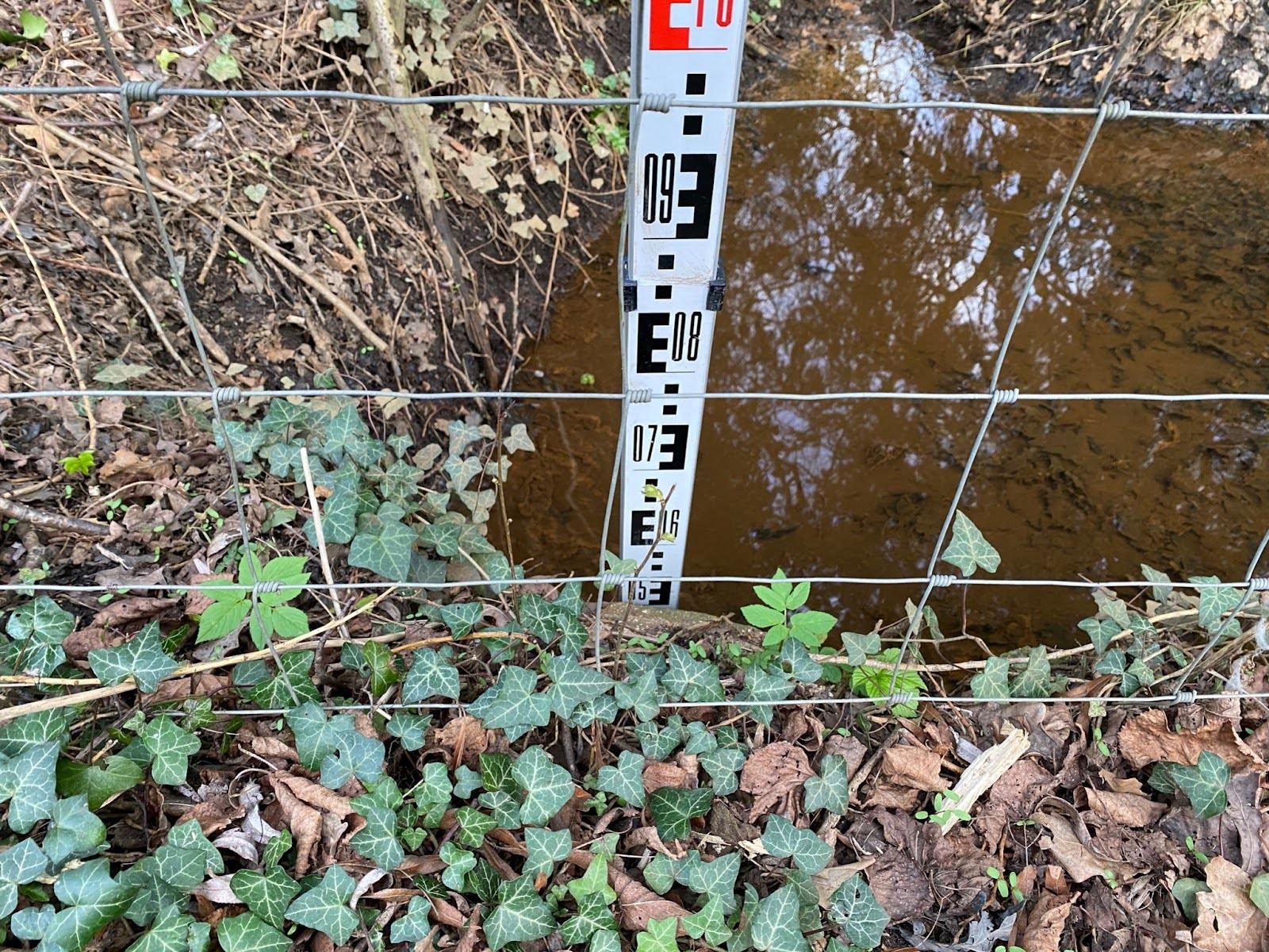 measuring the depth of a pipe in the ground