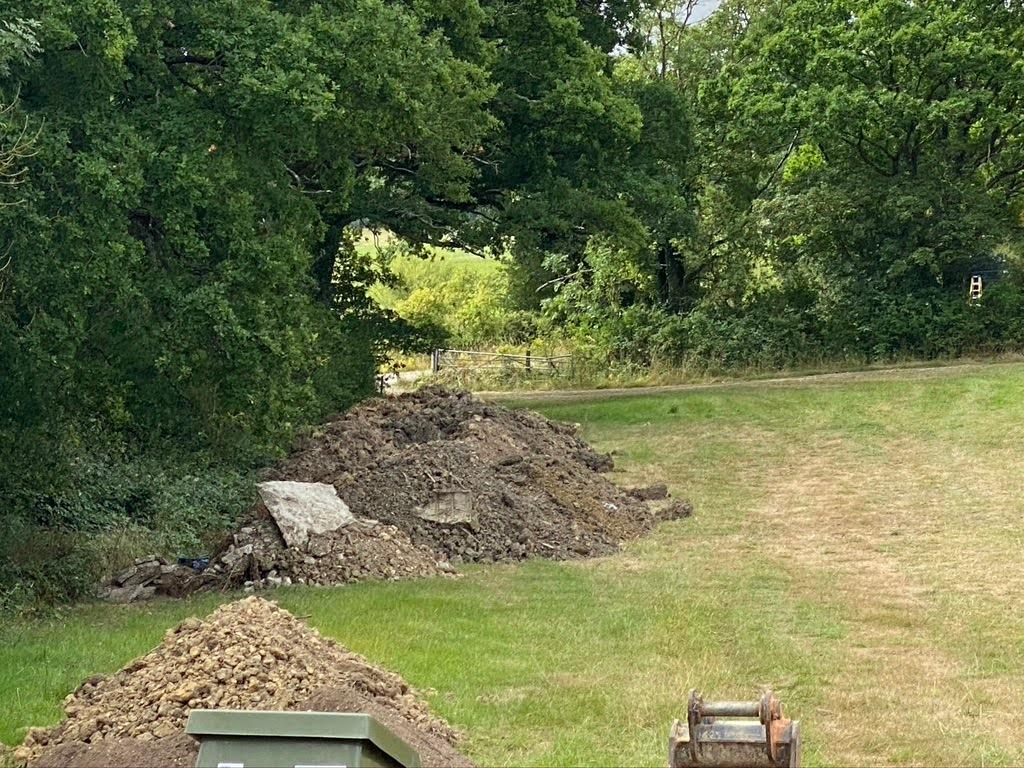 image of spoil pile arranged away from private sewage system installation