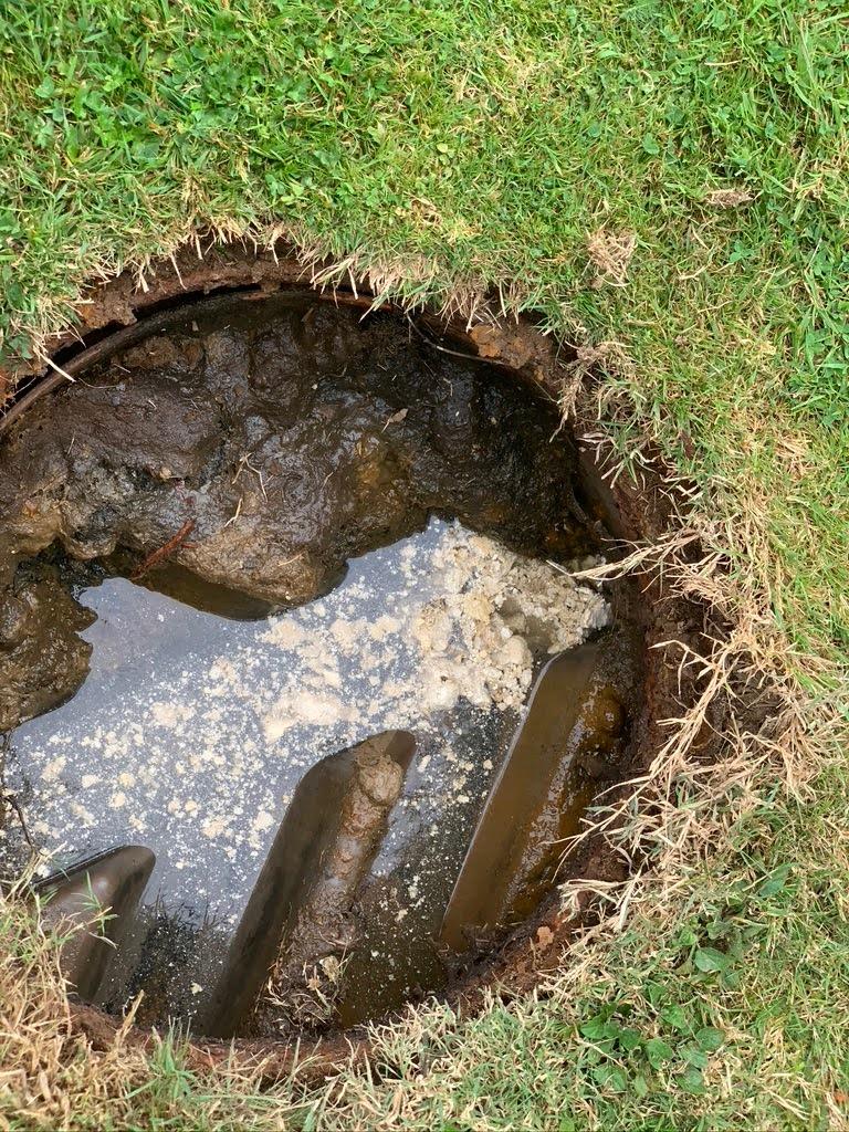 open drain blocked by fat and grease
