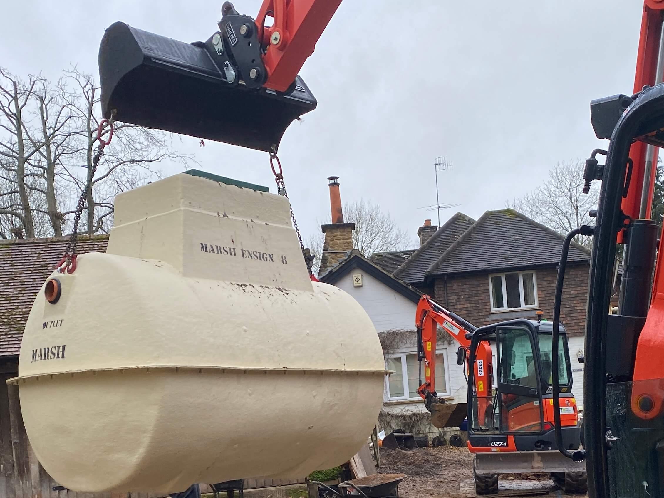 This is an image of a septic tank being lifted into place.