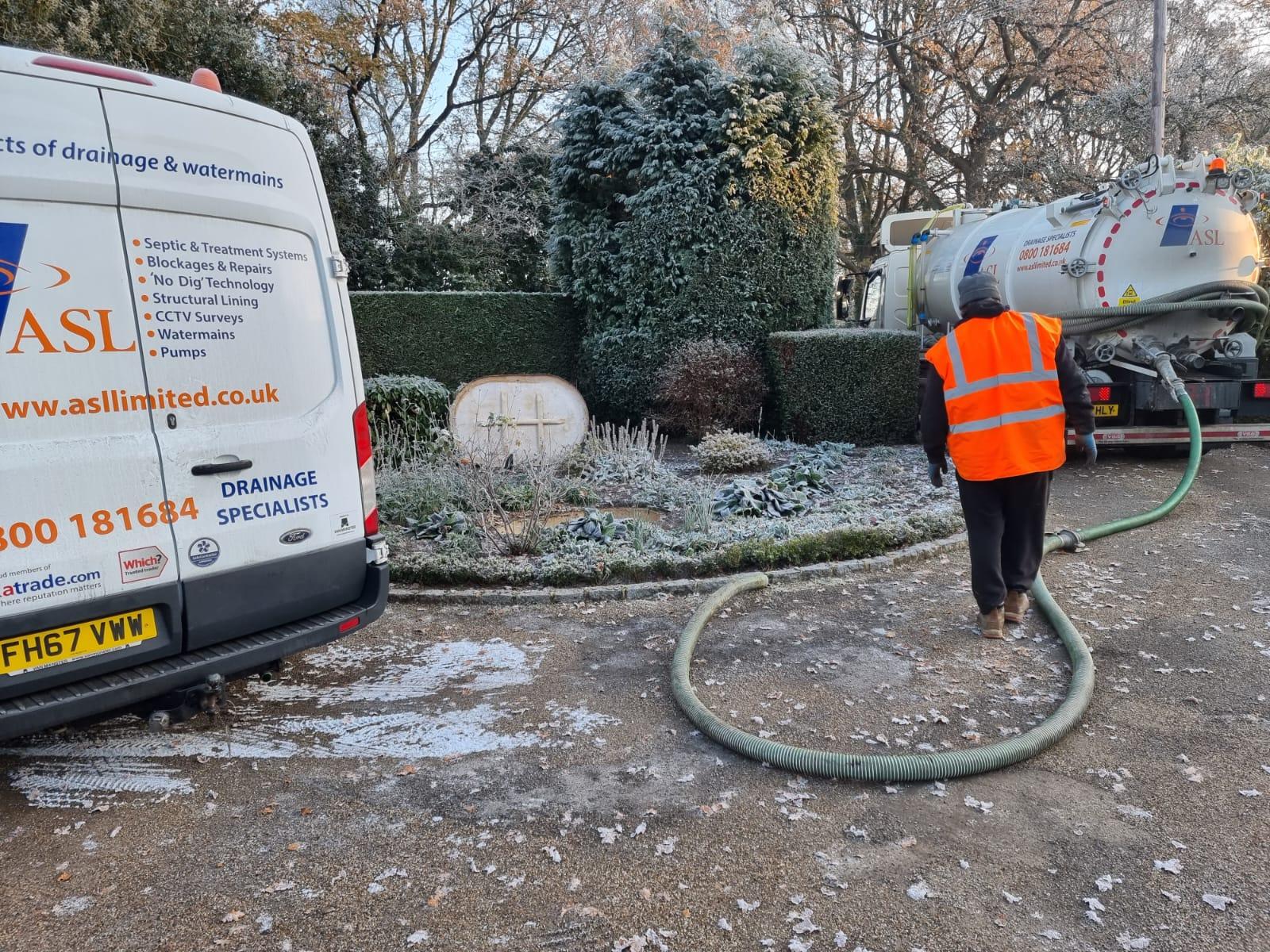 ASL Limited servicing a septic tank on a frosty morning. 