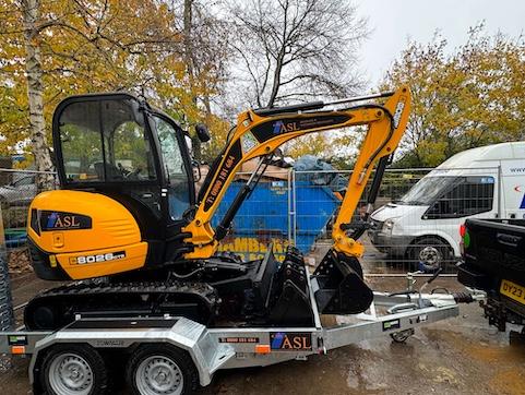 ASL Limited Digger being towed to the drainage yard.