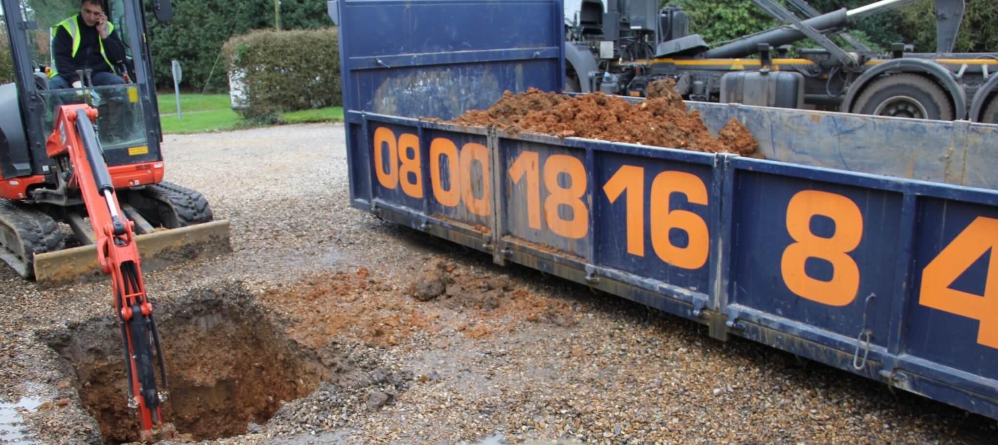 An image of the ASL Limited Low Loader at an installation of a driveway soakaway in Billingshurst.