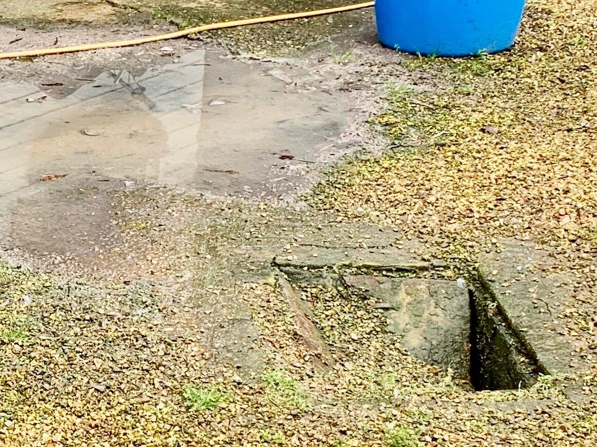 An image of a collapsed drain cover.
