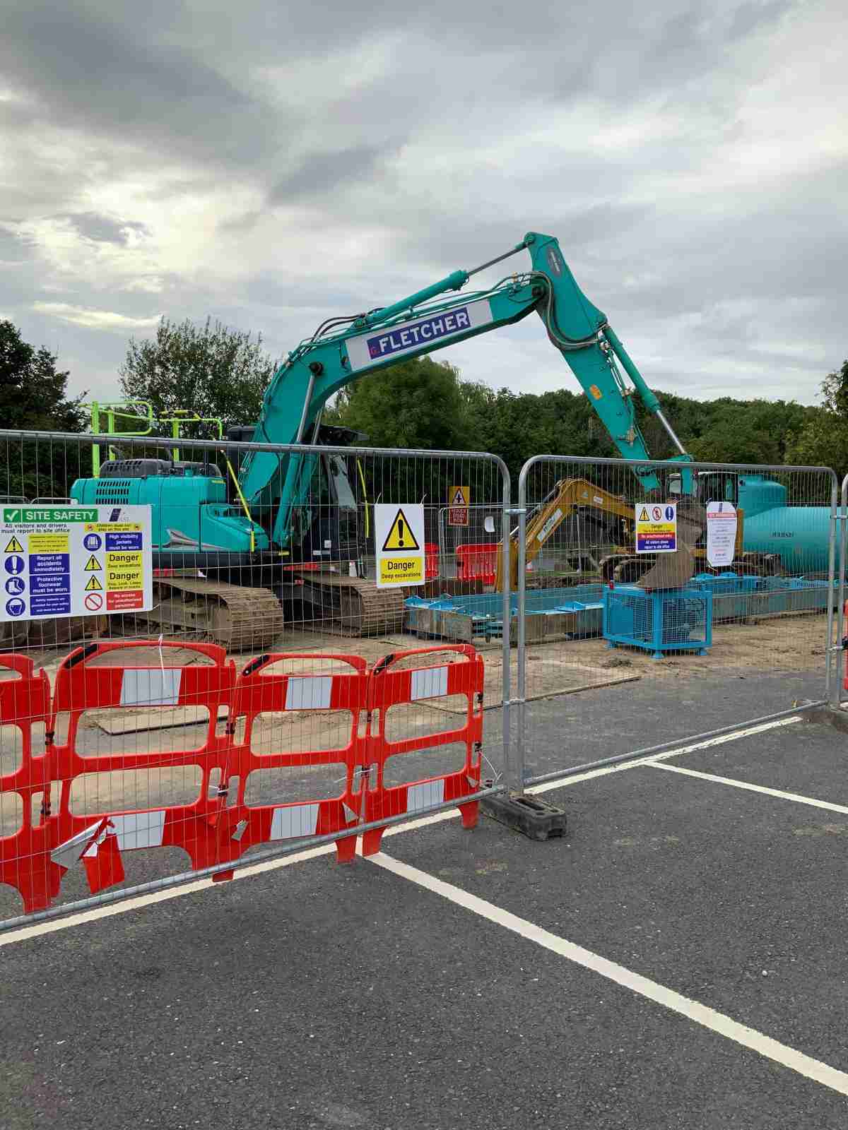 Excavators and barriers in place ready to install a new pump station for a garden centre.